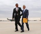 U.S. President Obama is greeted by Chicago Mayor Emanuel upon Obama's arrival in Chicago.