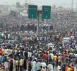 Nigerians gather during a protest against the scrapping of fuel subsidy