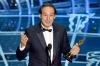 Alexandre Desplat sai Oscarin parhaasta musiikista elokuvasta The Grand Budapest Hotel.  AFP/Kevin Winter