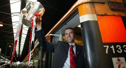 <p>Cork captain Ben O'Connor leaves Heuston station with the Liam MacCarthy Cup in 2004. Another season without the trophy would mean Cork hurling’s longest famine. Picture: INPHO/Andrew Paton</p>