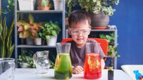Asian school kid studying science, making DIY Lava Lamp Science Experiment, Kid-friendly fun and easy science experiments at hom