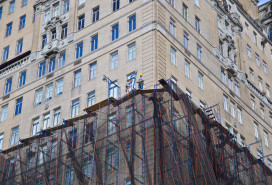 Scaffold workmen on high rise facade, New York City stock photo