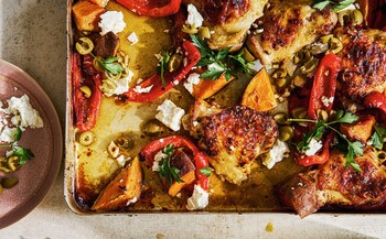 Roast chicken thighs with red peppers, sweet potatoes, green olives and feta
