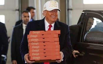 Donald Trump delivers pizzas while on the campaign trail in Iowa